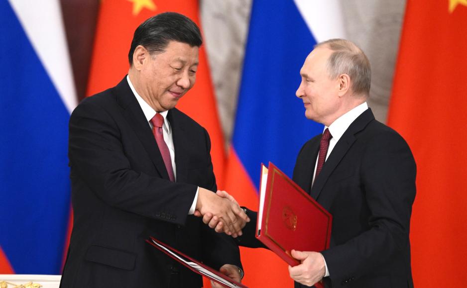 الرئيس الروسي في لقائه بنظيره الصيني